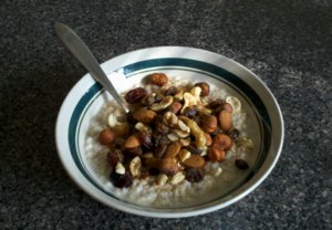 Oatmeal for breakfast - with nuts, berries, cinnamon, and sugar - by Anthony D. Morrow ADM